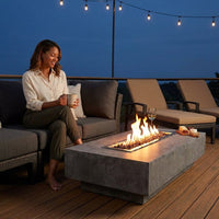Hampton Fire Table Outdoor Fire Pit 56" X 32" Cast Concrete Firepit Includes Lava Rocks 45,000 Btus Outdoor Fireplace for Patio Furniture Set, Deck, Porch, Outdoor Heater - Liquid Propane — Lifestyle